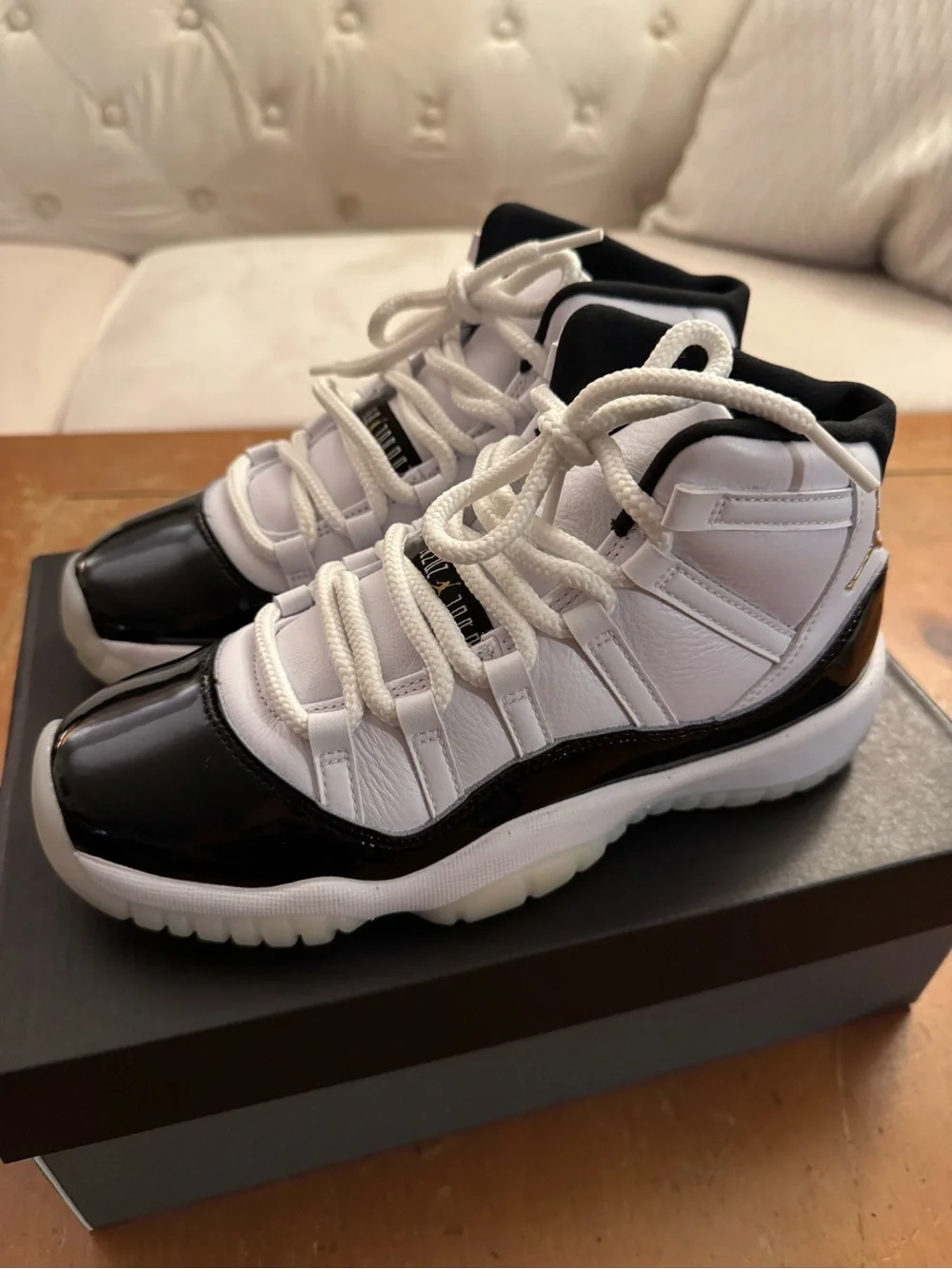 Air Jordan 11 Retro (GS) Big Kid’s Sneakers in White and Patent Black